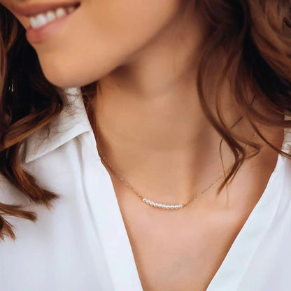 Women's gold necklace with imitation pearl pendant