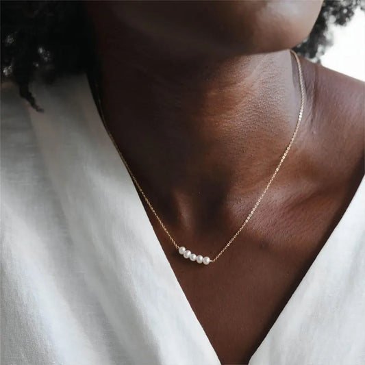 Women's gold necklace with imitation pearl pendant