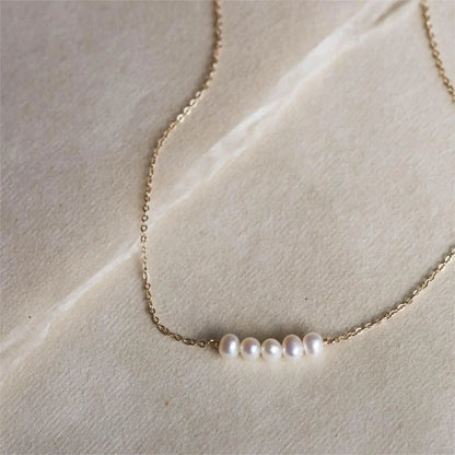 Women's gold necklace with imitation pearl pendant