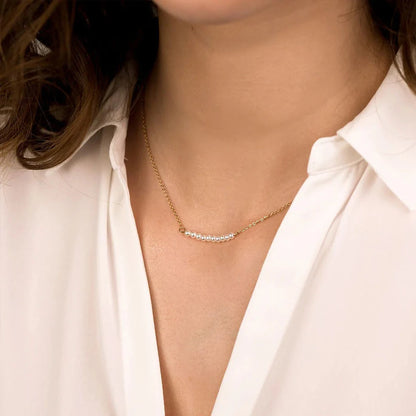 Women's gold necklace with imitation pearl pendant