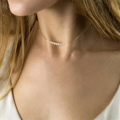 Women's gold necklace with imitation pearl pendant
