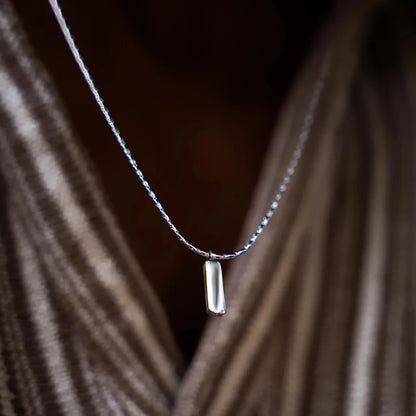 Bone chain with wire pendant
